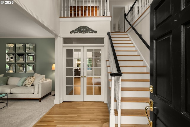 4503 NW 147th Ave, Portland, OR 97229 - foyer entrance featuring french doors, stairway, wood finished floors, and ornamental molding