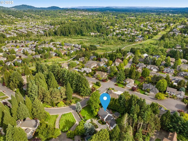 4503 NW 147th Ave, Portland, OR 97229 - aerial view of property's location with nearby suburban area, mountains, and a forest