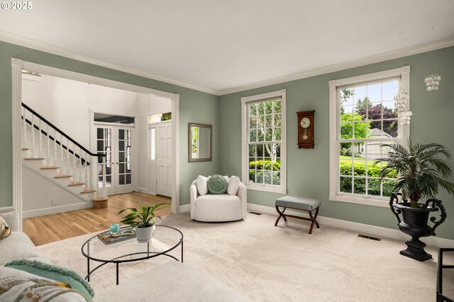 4503 NW 147th Ave, Portland, OR 97229 - living room featuring ornamental molding, baseboards, stairway, and french doors