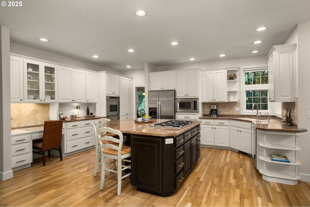 4503 NW 147th Ave, Portland, OR 97229 - kitchen with open shelves, appliances with stainless steel finishes, a sink, white cabinets, and dark cabinetry