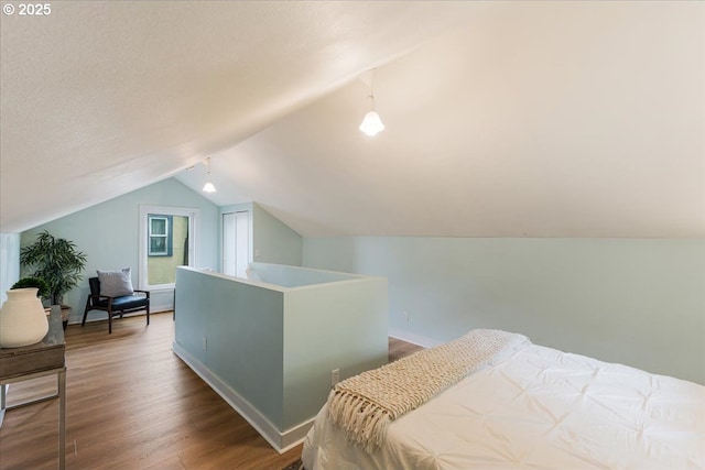 1716 N Rosa Parks Way, Portland, OR 97217 - bedroom featuring lofted ceiling, wood finished floors, and baseboards