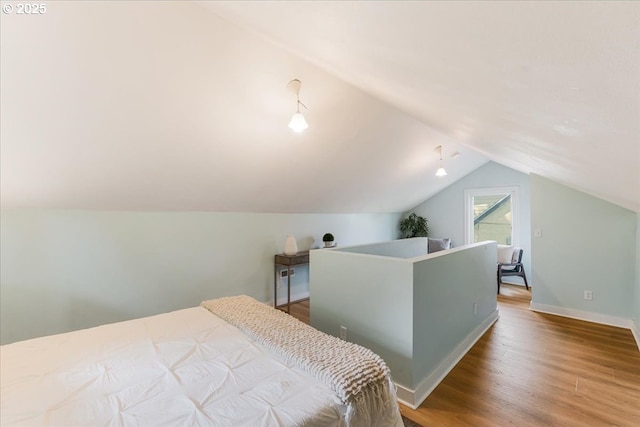 1716 N Rosa Parks Way, Portland, OR 97217 - bedroom with lofted ceiling, wood finished floors, and baseboards