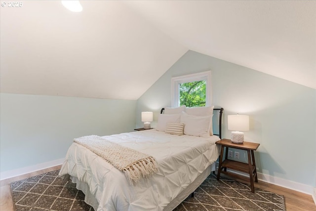 1716 N Rosa Parks Way, Portland, OR 97217 - bedroom with wood finished floors, lofted ceiling, and baseboards