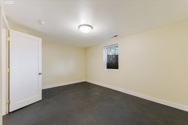 1716 N Rosa Parks Way, Portland, OR 97217 - unfurnished room featuring finished concrete floors, baseboards, and a smoke detector