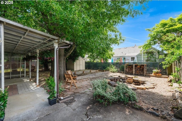 1716 N Rosa Parks Way, Portland, OR 97217 - fenced backyard featuring a patio area and a fire pit
