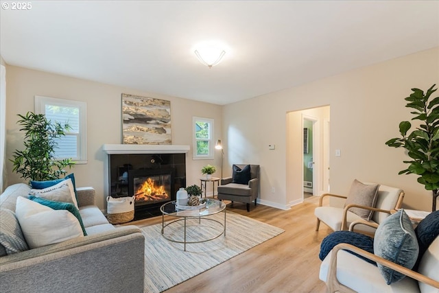 1716 N Rosa Parks Way, Portland, OR 97217 - living room featuring light wood finished floors, a fireplace, and baseboards