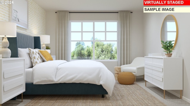 bedroom with brick wall and carpet flooring