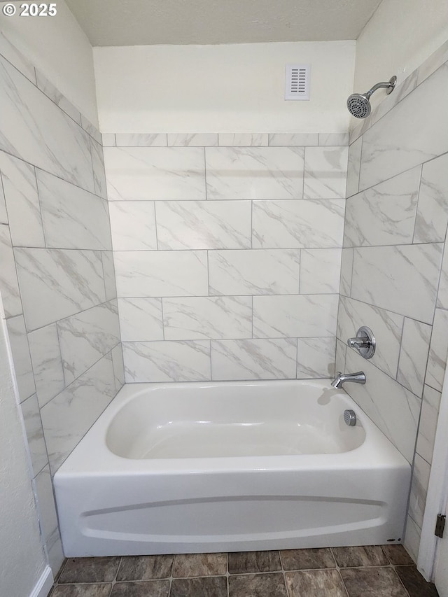 full bath featuring visible vents and shower / bathtub combination