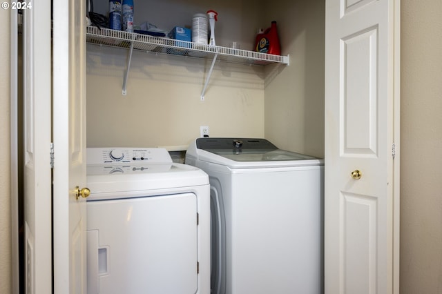 washroom with separate washer and dryer