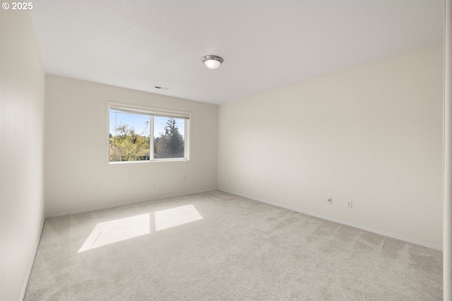 3816 NW Tustin Ranch Dr, Portland, OR 97229 - empty room featuring light carpet and baseboards
