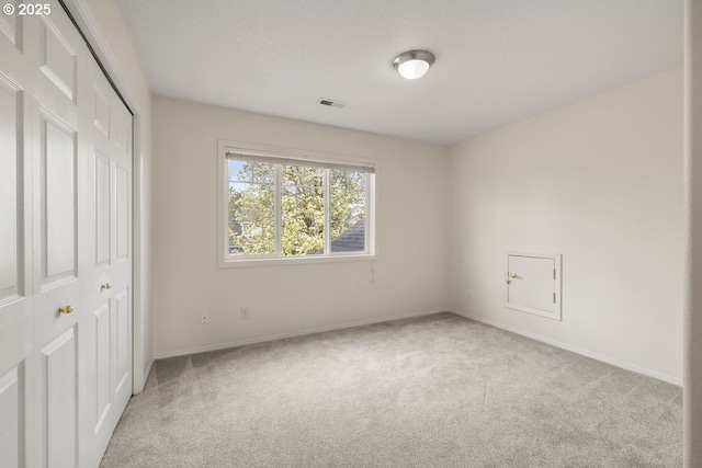 3816 NW Tustin Ranch Dr, Portland, OR 97229 - unfurnished bedroom featuring carpet, a closet, and baseboards