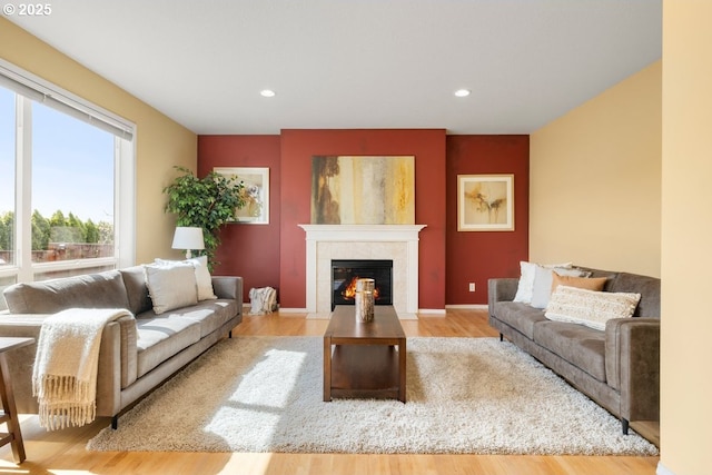 3816 NW Tustin Ranch Dr, Portland, OR 97229 - living room with a tiled fireplace, wood finished floors, recessed lighting, and baseboards