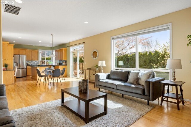 3816 NW Tustin Ranch Dr, Portland, OR 97229 - living area with light wood finished floors and recessed lighting