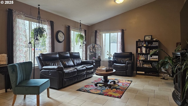 living area with light tile patterned floors and lofted ceiling