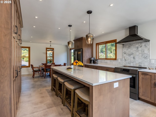 12720 S Carus Rd, Oregon City, OR 97045 - kitchen with recessed lighting, high end black refrigerator, wall chimney exhaust hood, and stainless steel electric range