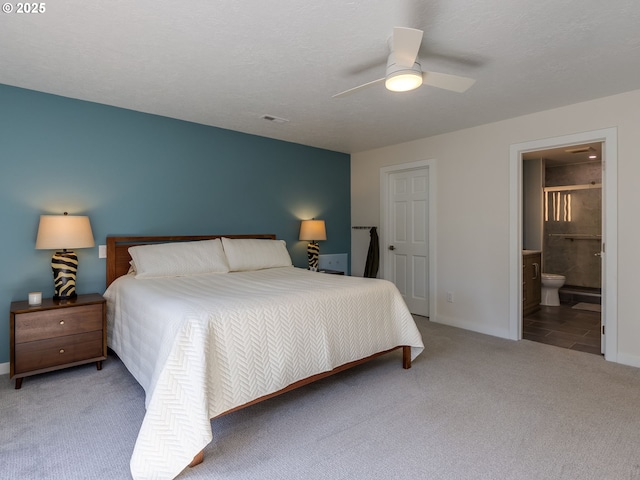 12720 S Carus Rd, Oregon City, OR 97045 - carpeted bedroom with connected bathroom, baseboards, a ceiling fan, and visible vents