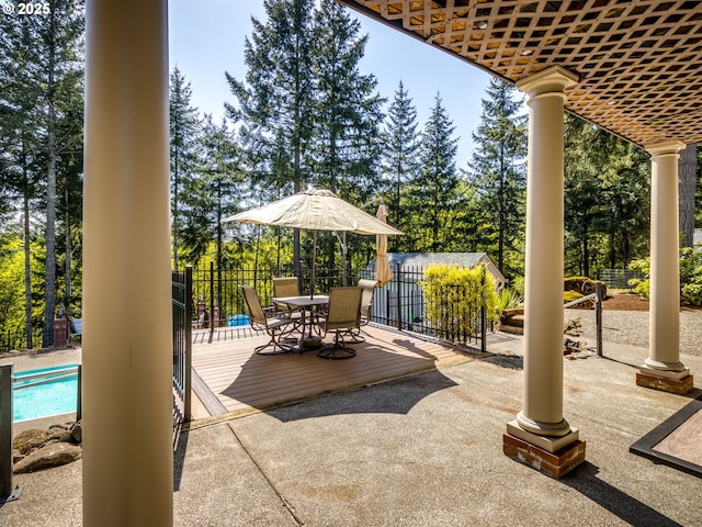 12720 S Carus Rd, Oregon City, OR 97045 - view of patio / terrace featuring fence, a wooden deck, a fenced in pool, and outdoor dining area