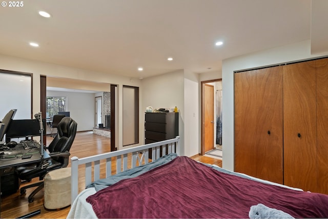 bedroom with light hardwood / wood-style floors