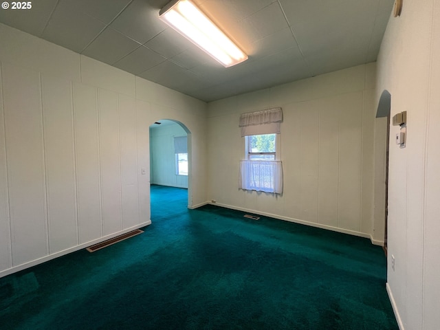 2909 College St, Baker City, OR 97814 - spare room with arched walkways and dark carpet