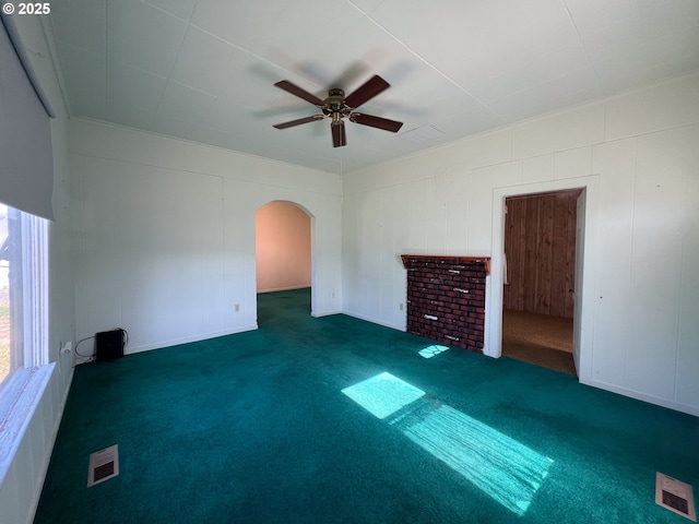 2909 College St, Baker City, OR 97814 - carpeted empty room featuring arched walkways and a ceiling fan