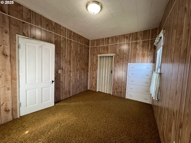2909 College St, Baker City, OR 97814 - empty room with carpet and wood walls