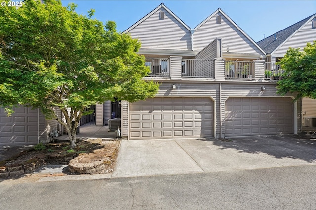 240 NE 5th St, Gresham, OR 97030 - multi unit property with a balcony, driveway, and a garage