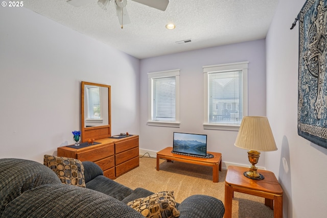 240 NE 5th St, Gresham, OR 97030 - living area with carpet floors, a textured ceiling, a ceiling fan, and baseboards