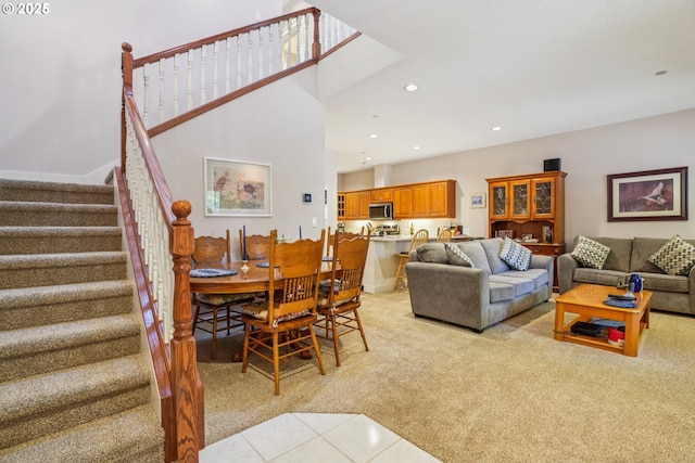 240 NE 5th St, Gresham, OR 97030 - living area with light carpet, stairway, recessed lighting, and light tile patterned floors