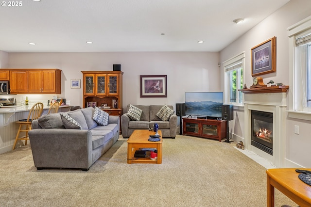 240 NE 5th St, Gresham, OR 97030 - living area featuring carpet floors, a fireplace with flush hearth, and recessed lighting