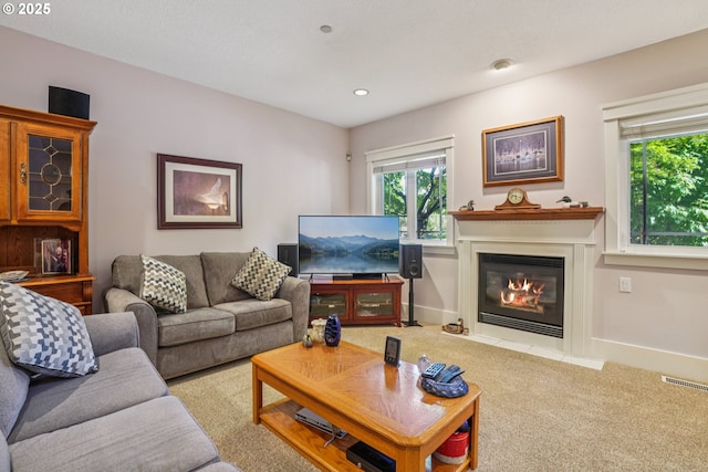 240 NE 5th St, Gresham, OR 97030 - living area with carpet, a fireplace with flush hearth, baseboards, and recessed lighting