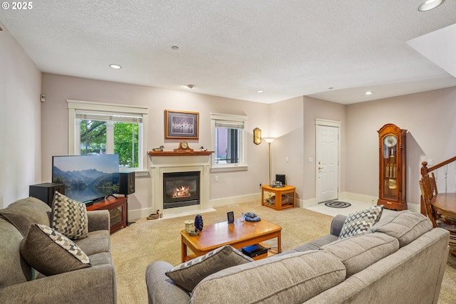 240 NE 5th St, Gresham, OR 97030 - living room featuring carpet flooring, recessed lighting, a glass covered fireplace, a textured ceiling, and baseboards