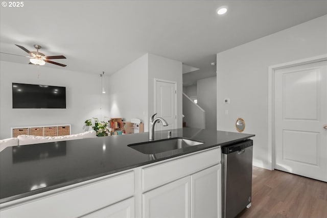 kitchen featuring dishwasher, sink, white cabinets, ceiling fan, and dark hardwood / wood-style floors