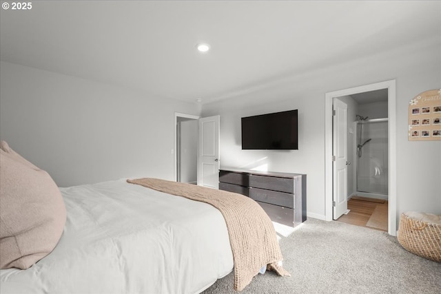 carpeted bedroom with ensuite bathroom