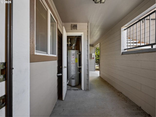 exterior space featuring visible vents and water heater