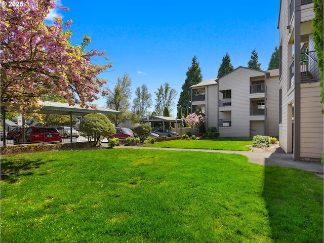view of property's community with a yard