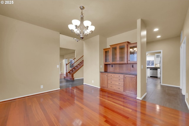 interior space with dark wood-type flooring and a chandelier