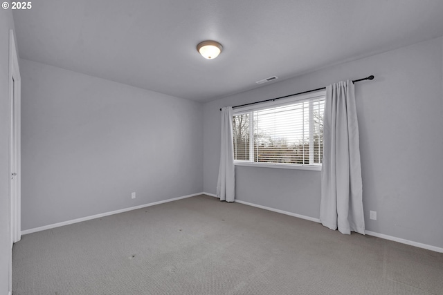 empty room featuring light carpet