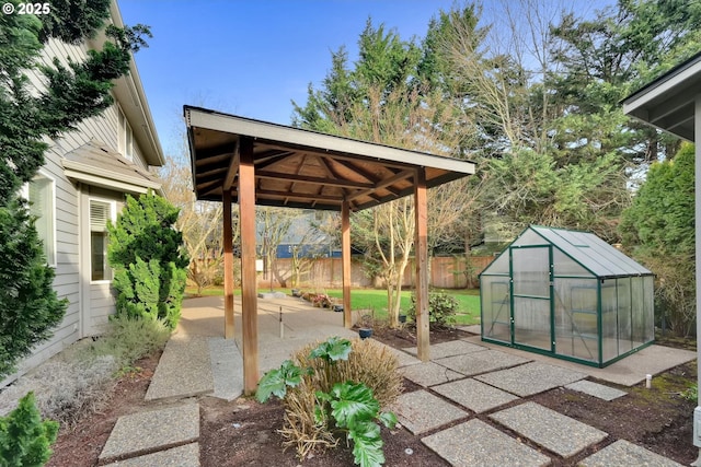 view of patio featuring an outbuilding and a gazebo