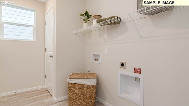 laundry area featuring washer hookup, hookup for an electric dryer, and hardwood / wood-style floors