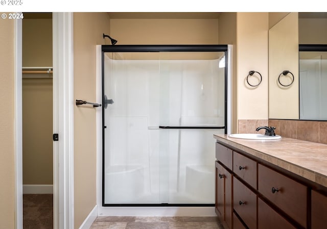 bathroom featuring vanity and walk in shower