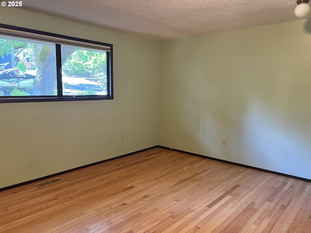 16042 Cornell St, Lake Oswego, OR 97034 - spare room with light wood-type flooring and a textured ceiling