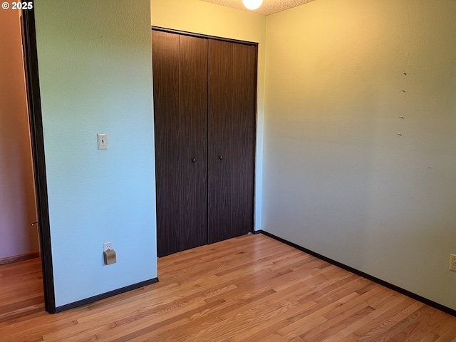 16042 Cornell St, Lake Oswego, OR 97034 - unfurnished bedroom with a closet and light wood-style floors