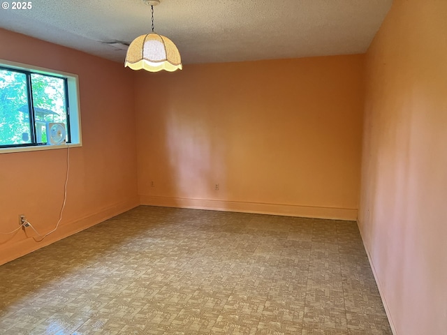 16042 Cornell St, Lake Oswego, OR 97034 - unfurnished room featuring a textured ceiling and baseboards