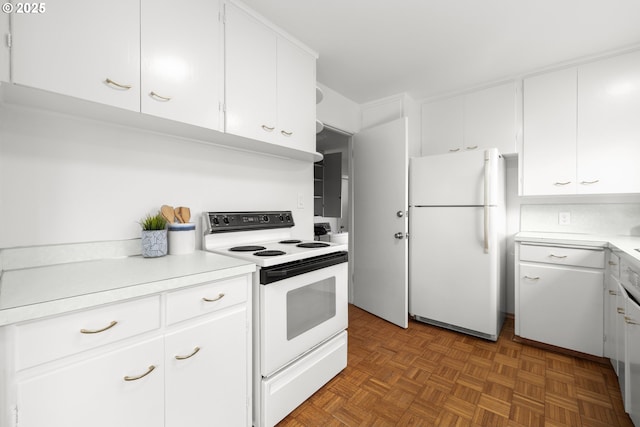 kitchen with white appliances, light countertops, and white cabinets