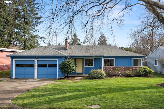 ranch-style home with a garage, driveway, a front lawn, board and batten siding, and brick siding