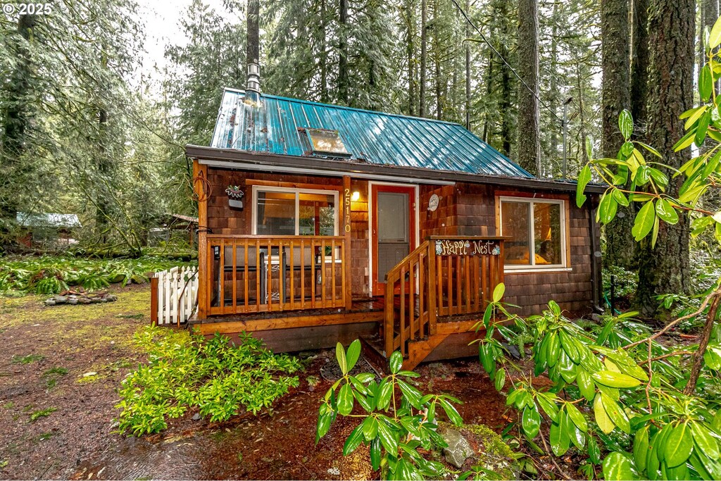 25170 E Old Smokey Rd, Rhododendron, OR 97049 - view of front of property with covered porch and metal roof