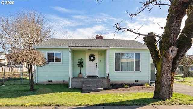 bungalow-style house with roof with shingles, a chimney, crawl space, fence, and a front lawn