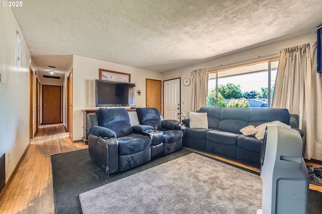 6135 SE Clatsop St, Portland, OR 97206 - living room with light wood-style floors and a textured ceiling