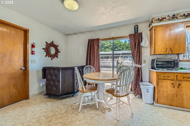 6135 SE Clatsop St, Portland, OR 97206 - dining space featuring baseboards