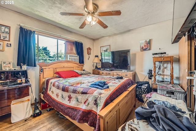 6135 SE Clatsop St, Portland, OR 97206 - bedroom featuring wood finished floors, ceiling fan, and cooling unit